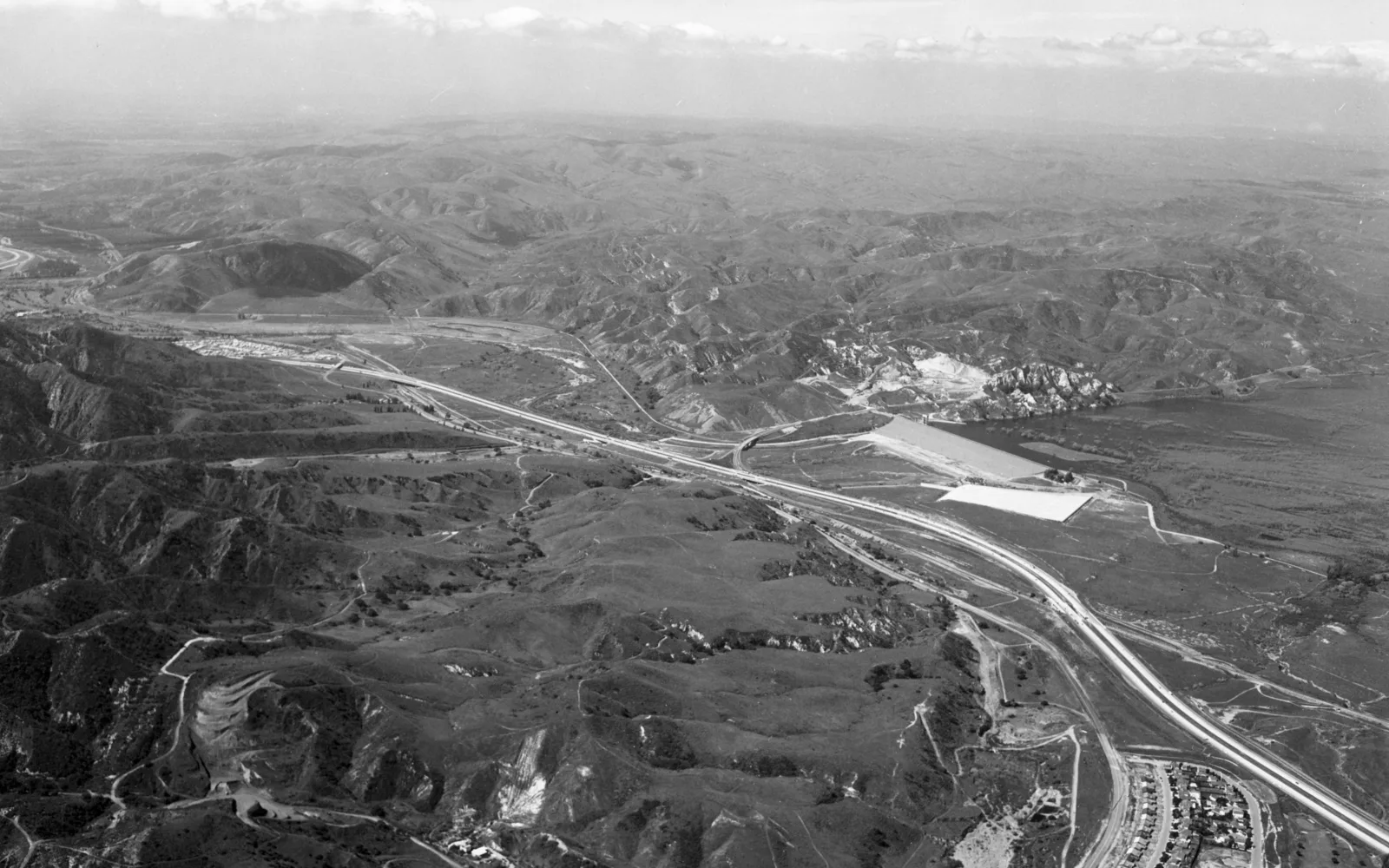 Aerial view of Prado Dam in Santa Ana Canyon showing river infrastructure