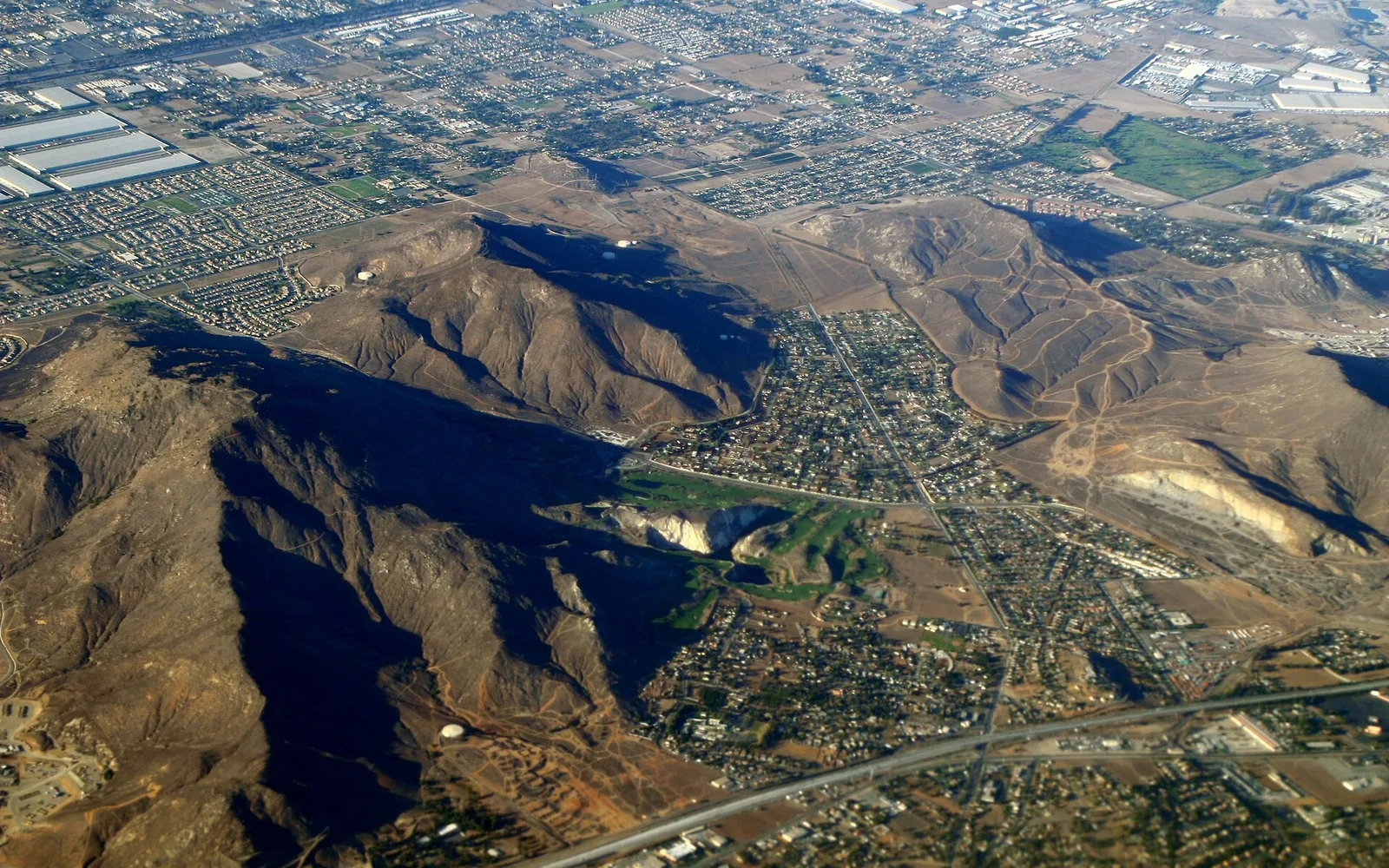 Aerial view of the Sunnyslope neighborhood and surrounding hills in Jurupa Valley, California